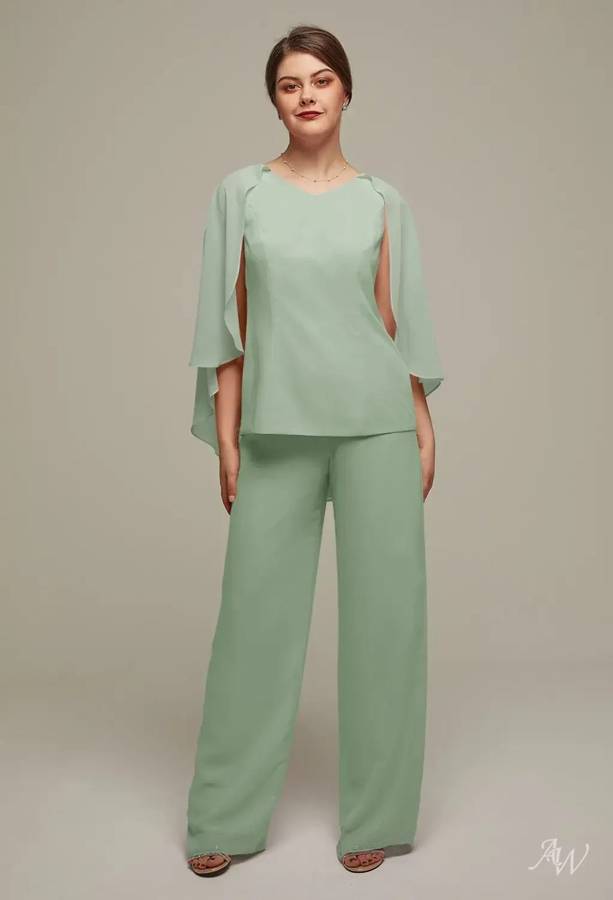 A sage green chiffon top with cape sleeves and wide-leg pants