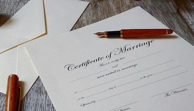 A blank certificate of marriage with a fountain pen